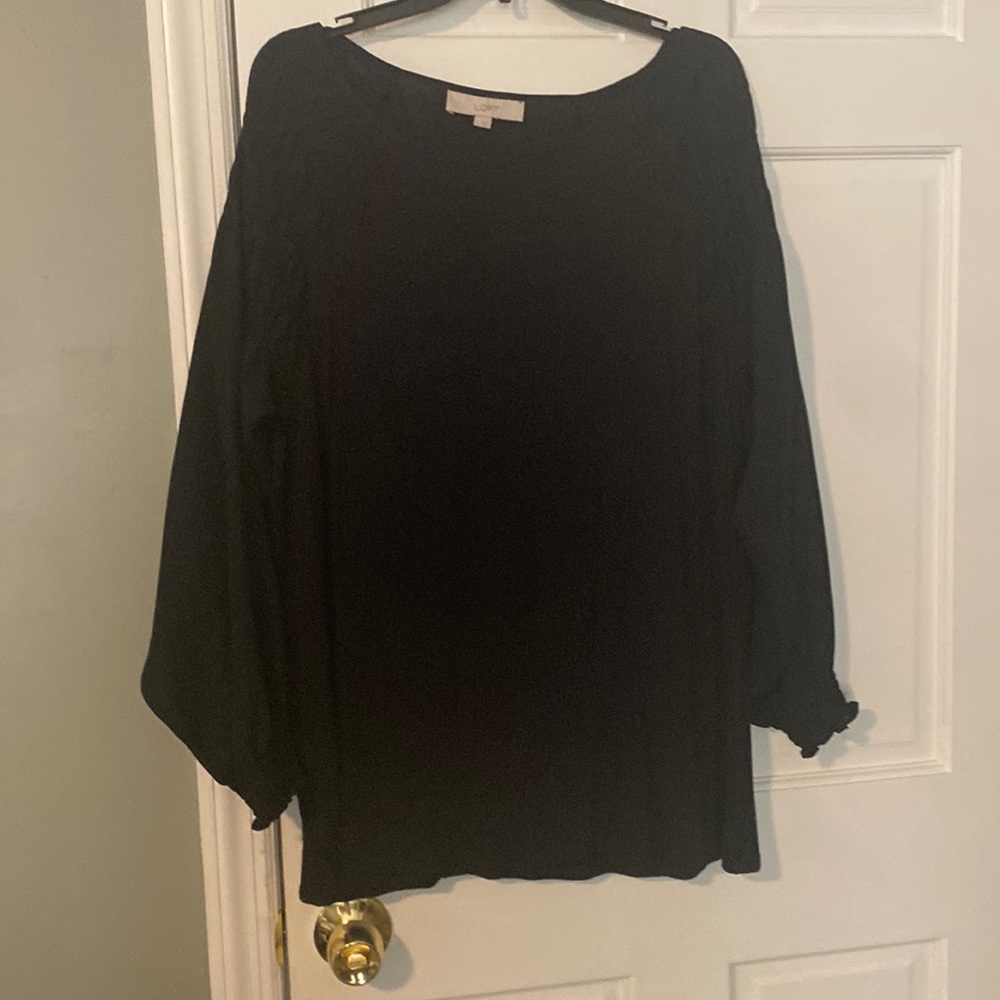 Navy blue blouse with poet sleeves.